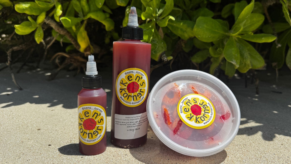 Three bottles and a container of Ken's Korner Lemon Li Hing Mui Sauce on a concrete surface with greenery in the background.